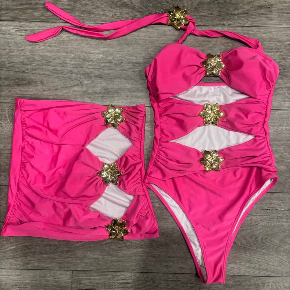 Elegant Pink One-Piece Swimsuit with Gold Accents